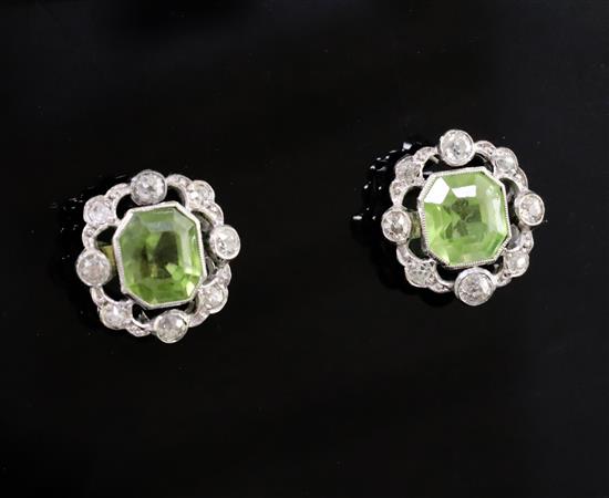 A pair of mid 20th century white gold, peridot and diamond cluster set earstuds, gross 3.1 grams.